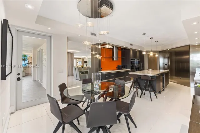 a view of a swimming pool with an outdoor seating