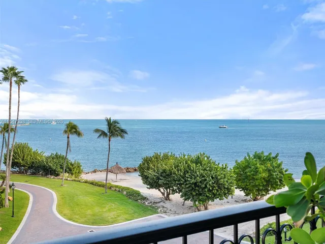 a view of a living room and balcony
