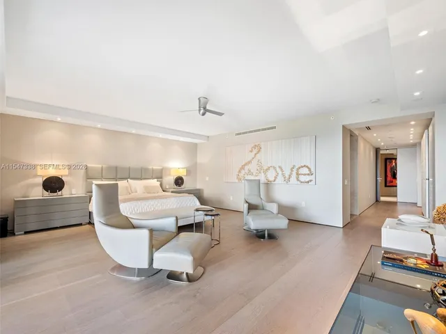 a living room with furniture and a lamp