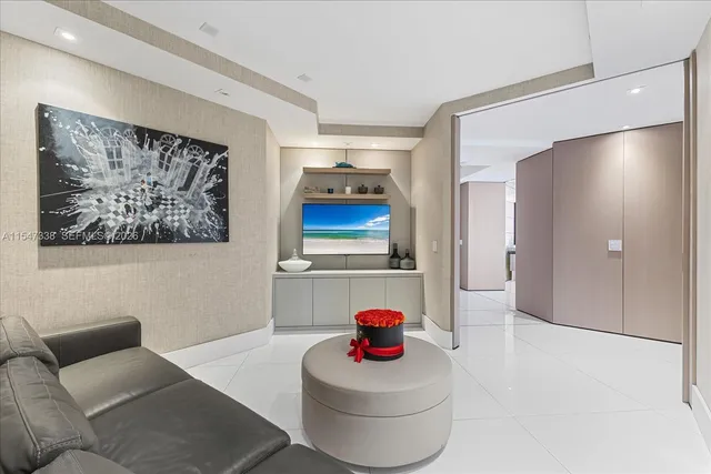 a view of a balcony with couch and wooden floor