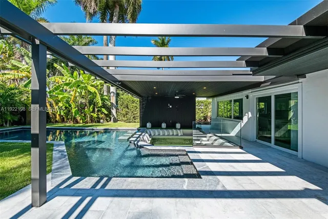 a view of swimming pool with a patio