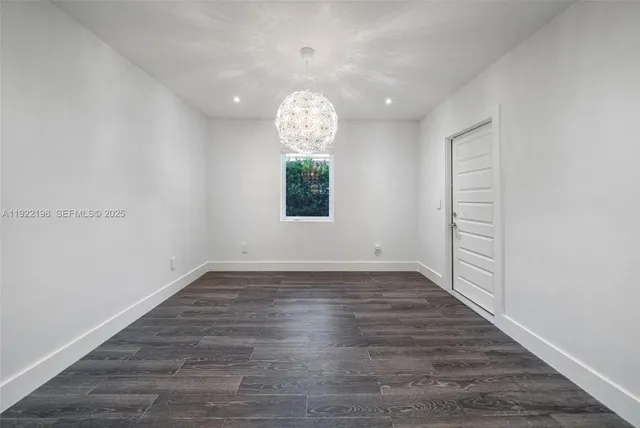 a view of a bathroom with mirror and window