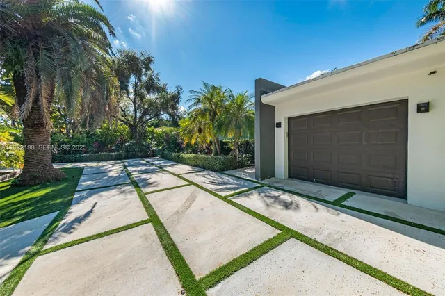a view of a house with backyard porch and sitting area