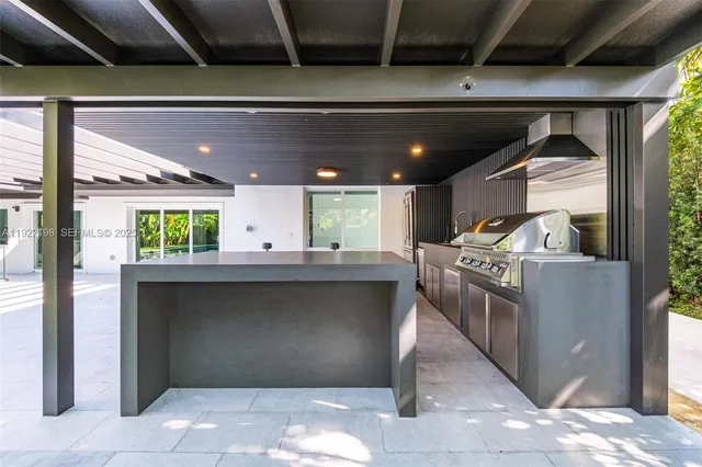 a kitchen with stove and cabinets