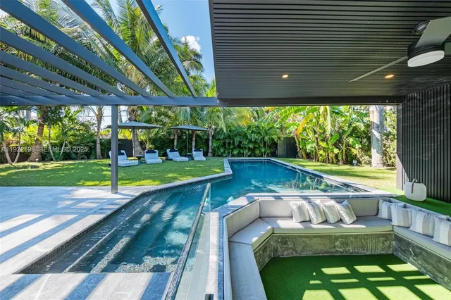 a view of swimming pool with a patio