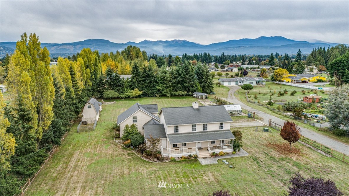 a view of a swimming pool with a yard