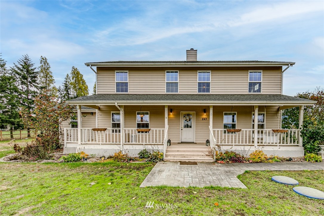 243 Griffith Farm Road Sequim, WA 98382 - Photo 2 of 35 a front view of a house with a yard