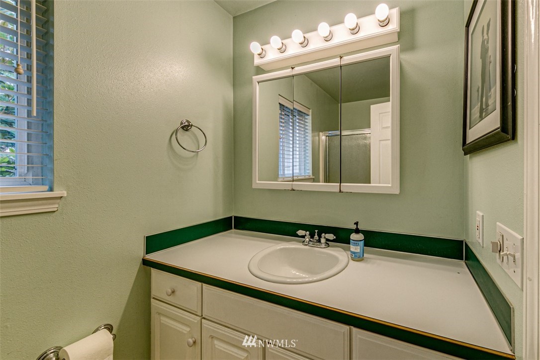 243 Griffith Farm Road Sequim, WA 98382 - Photo 13 of 35 a bathroom with a sink and a mirror