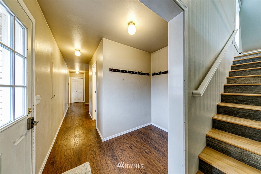 243 Griffith Farm Road Sequim, WA 98382 - Photo 15 of 35 a view of a hallway with wooden floor and staircase
