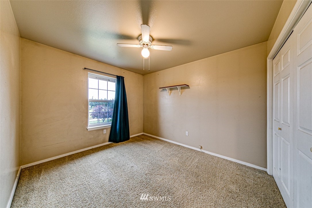 243 Griffith Farm Road Sequim, WA 98382 - Photo 19 of 35 an empty room with windows and fan