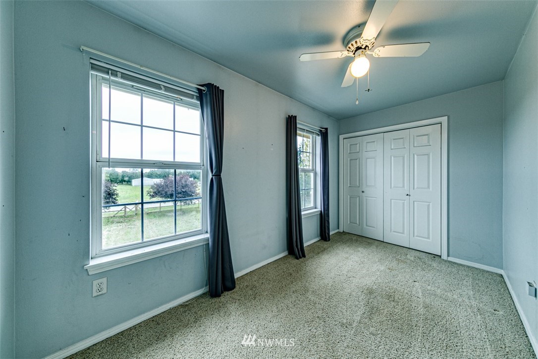 243 Griffith Farm Road Sequim, WA 98382 - Photo 20 of 35 a view of a livingroom with a ceiling fan and window