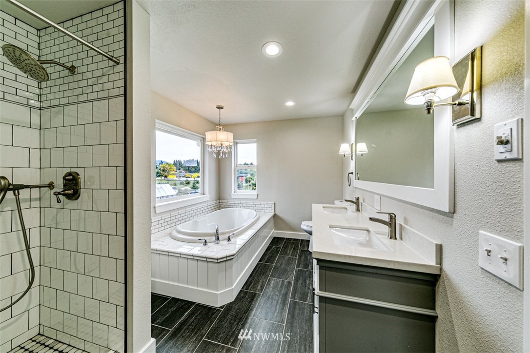 243 Griffith Farm Road Sequim, WA 98382 - Photo 23 of 35 a bathroom with a sink a toilet and shower