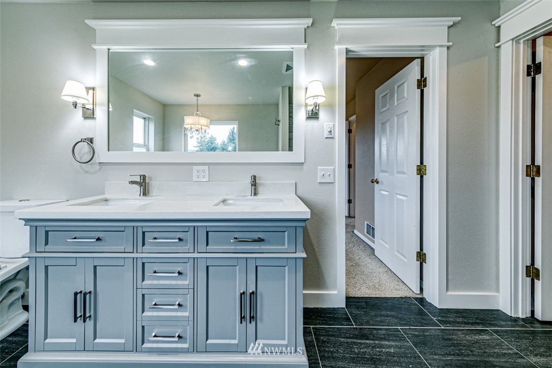 243 Griffith Farm Road Sequim, WA 98382 - Photo 24 of 35 a bathroom with a sink and a mirror