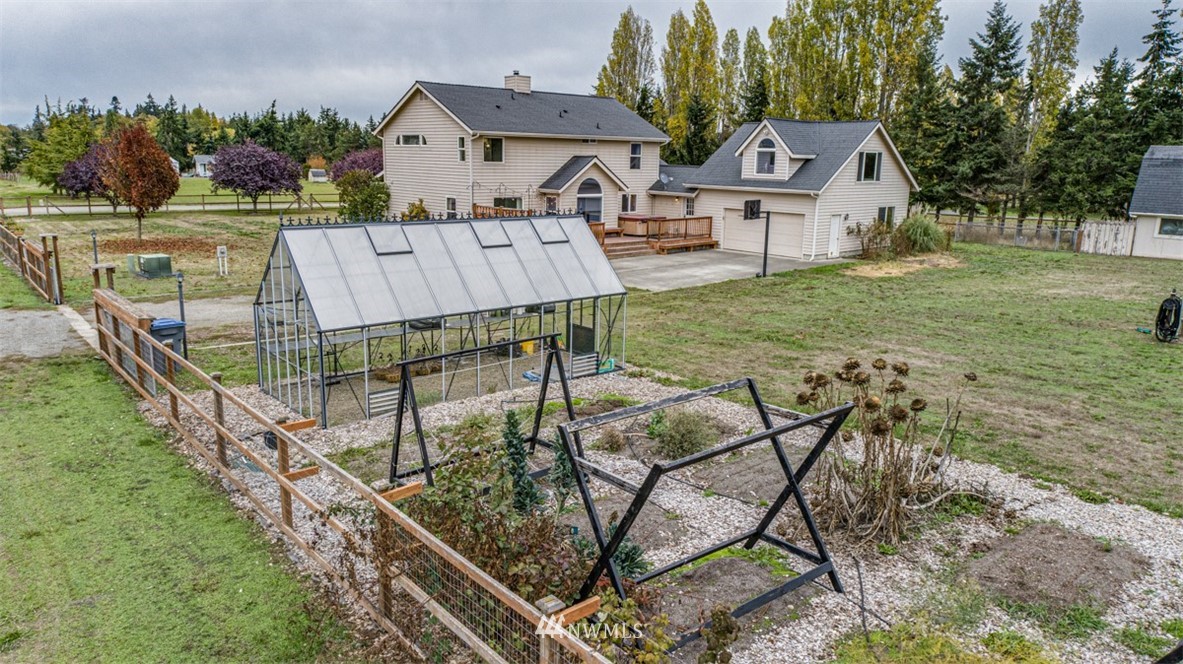 243 Griffith Farm Road Sequim, WA 98382 - Photo 34 of 35 a view of house with backyard and outdoor seating