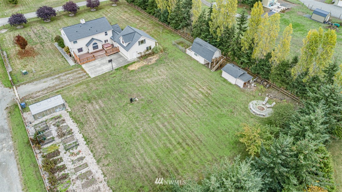 243 Griffith Farm Road Sequim, WA 98382 - Photo 35 of 35 an aerial view of a house with garden space and street view