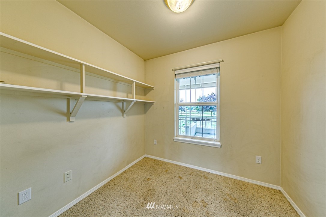 243 Griffith Farm Road Sequim, WA 98382 - Photo 10 of 35 a view of a room with rack on the wall and a window