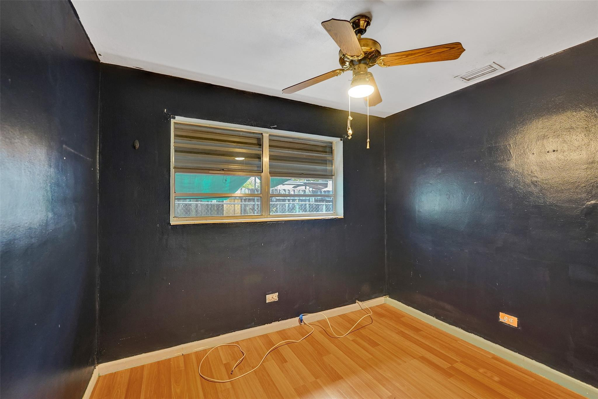 1960 Southwest 68th Way Miramar, FL 33023 - Photo 11 of 39 a bedroom with a bed and a window