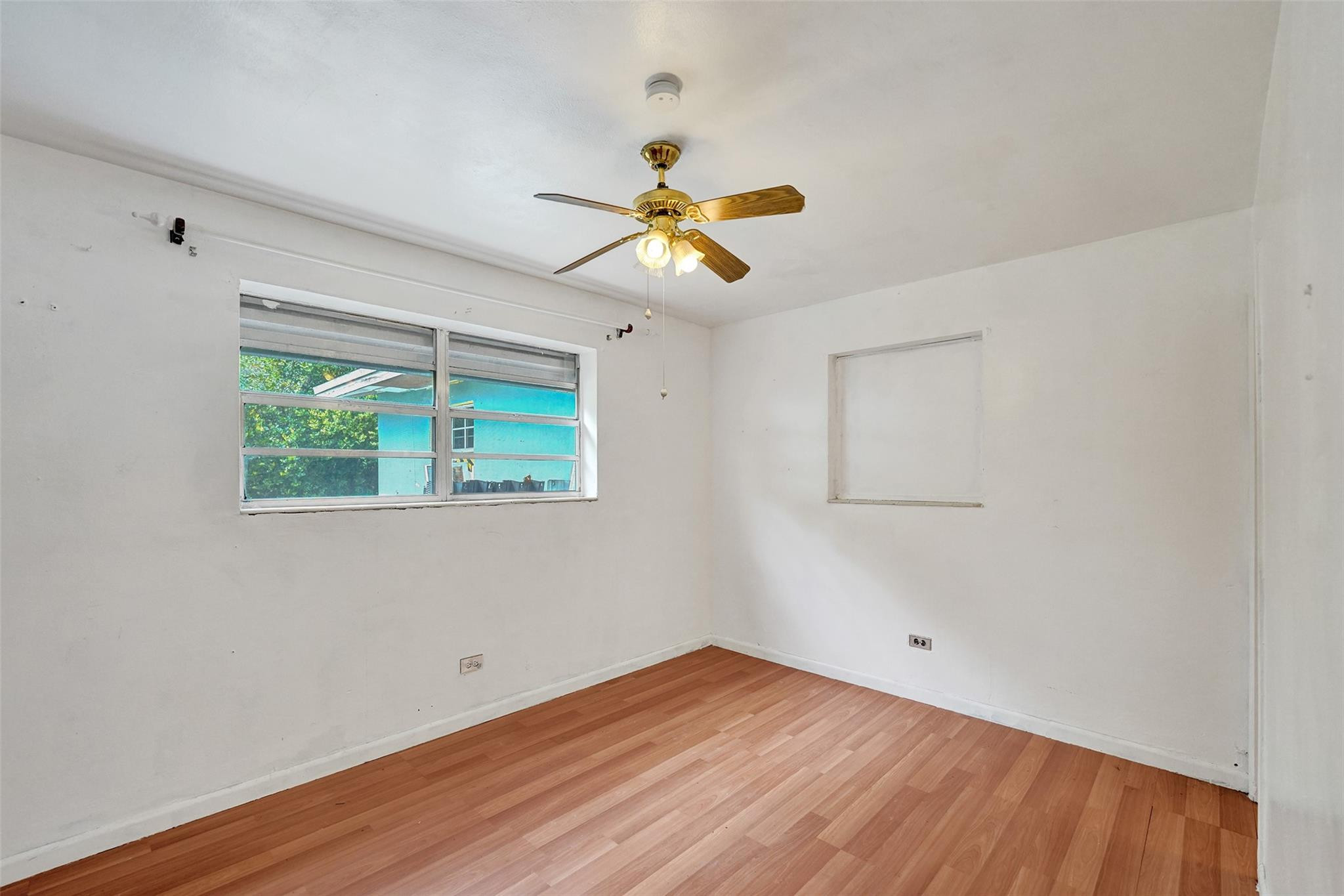 1960 Southwest 68th Way Miramar, FL 33023 - Photo 15 of 39 wooden floor in an empty room with a window