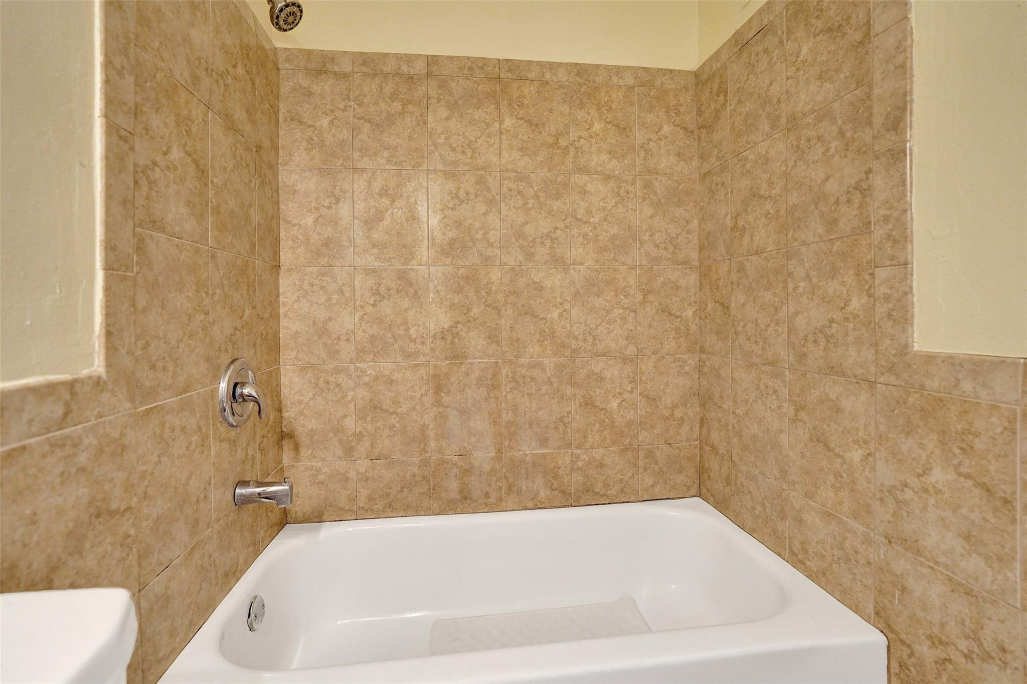 1960 Southwest 68th Way Miramar, FL 33023 - Photo 17 of 39 a bathroom with a bathtub