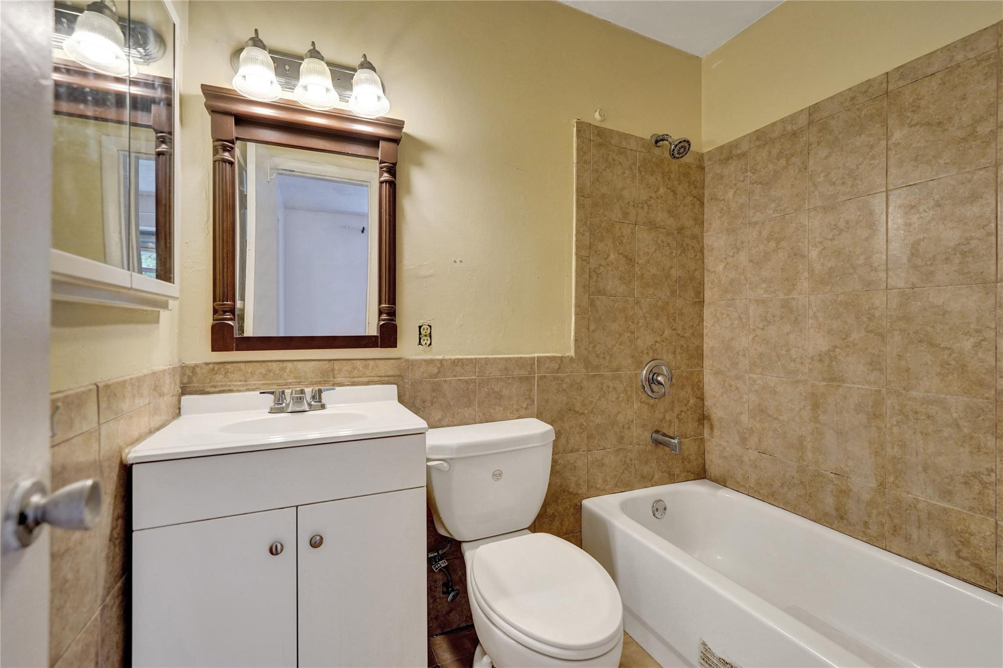 1960 Southwest 68th Way Miramar, FL 33023 - Photo 18 of 39 a bathroom with a sink a toilet and shower