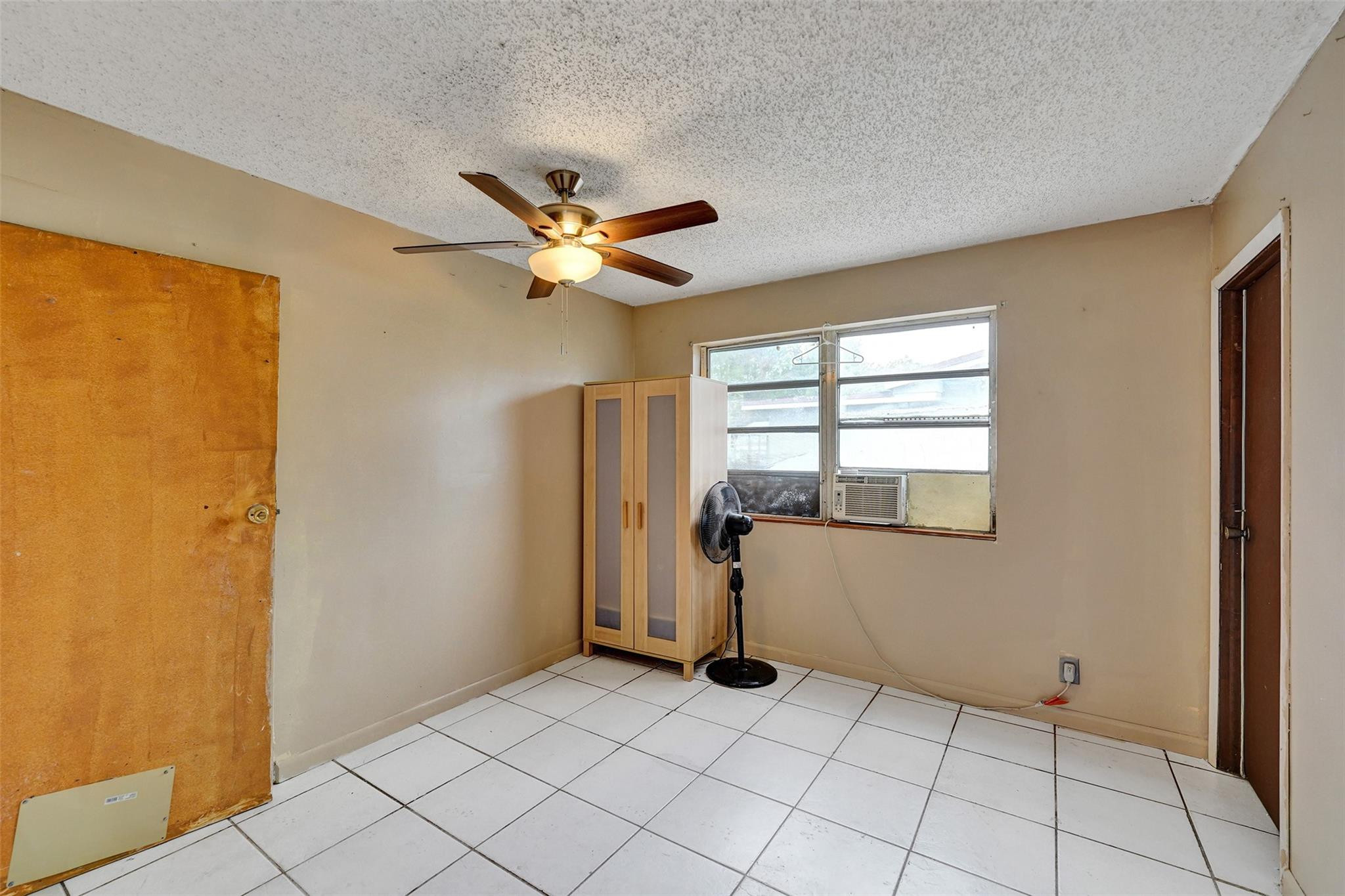 1960 Southwest 68th Way Miramar, FL 33023 - Photo 20 of 39 a view of an empty room with a window