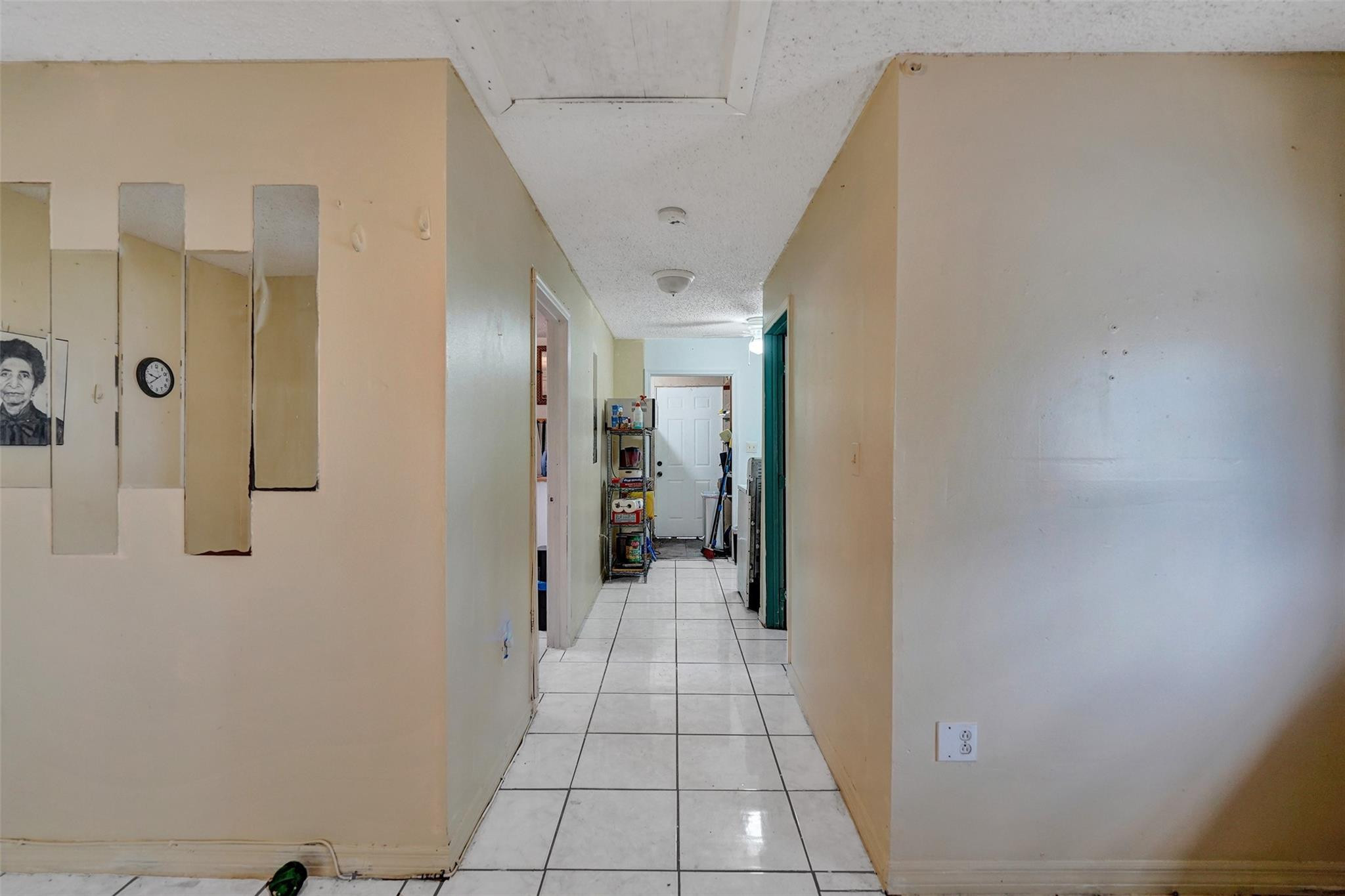 1960 Southwest 68th Way Miramar, FL 33023 - Photo 29 of 39 a view of a hallway with wooden floor and a bathroom