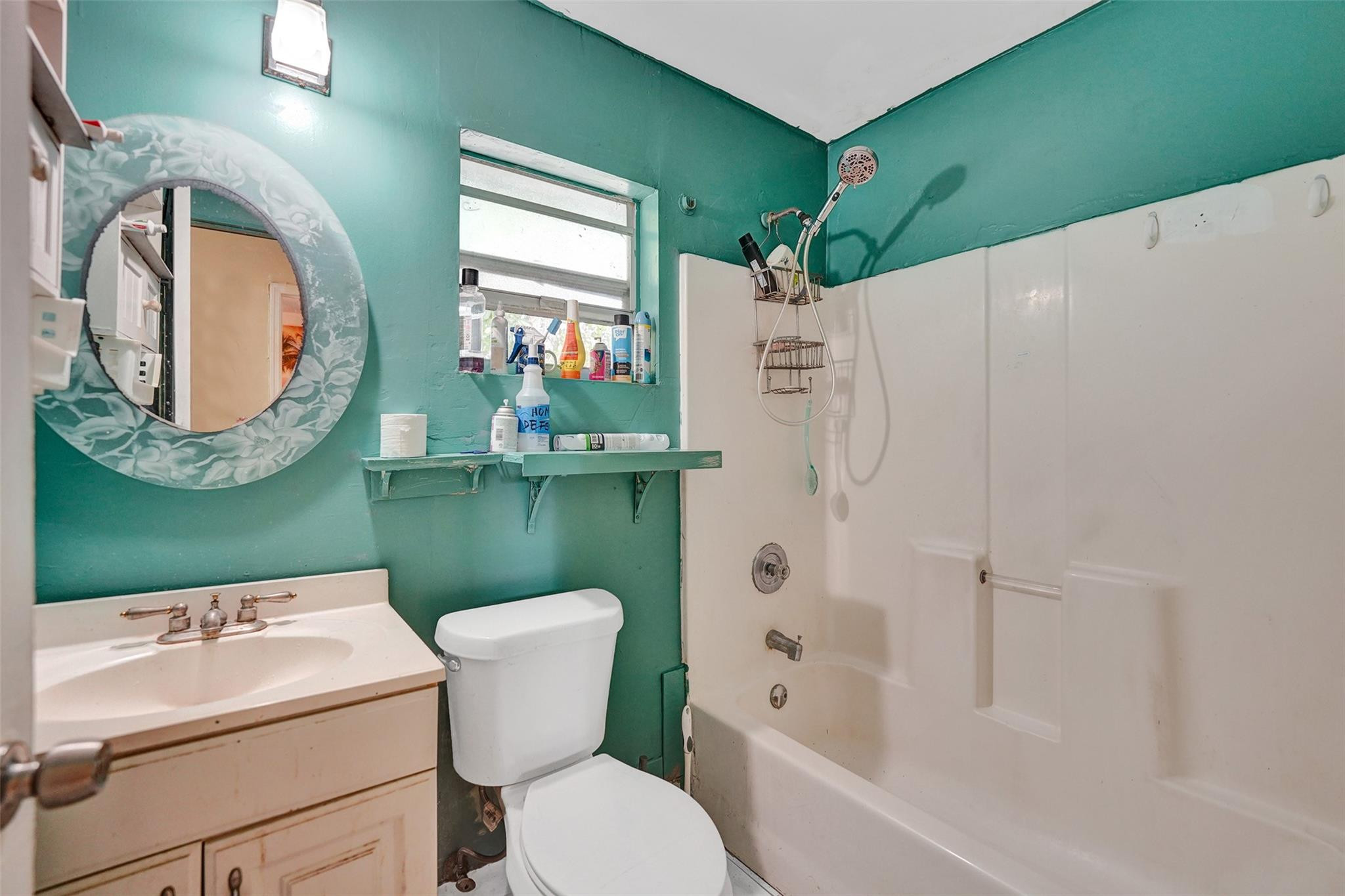 1960 Southwest 68th Way Miramar, FL 33023 - Photo 30 of 39 a bathroom with a sink mirror toilet and bathtub