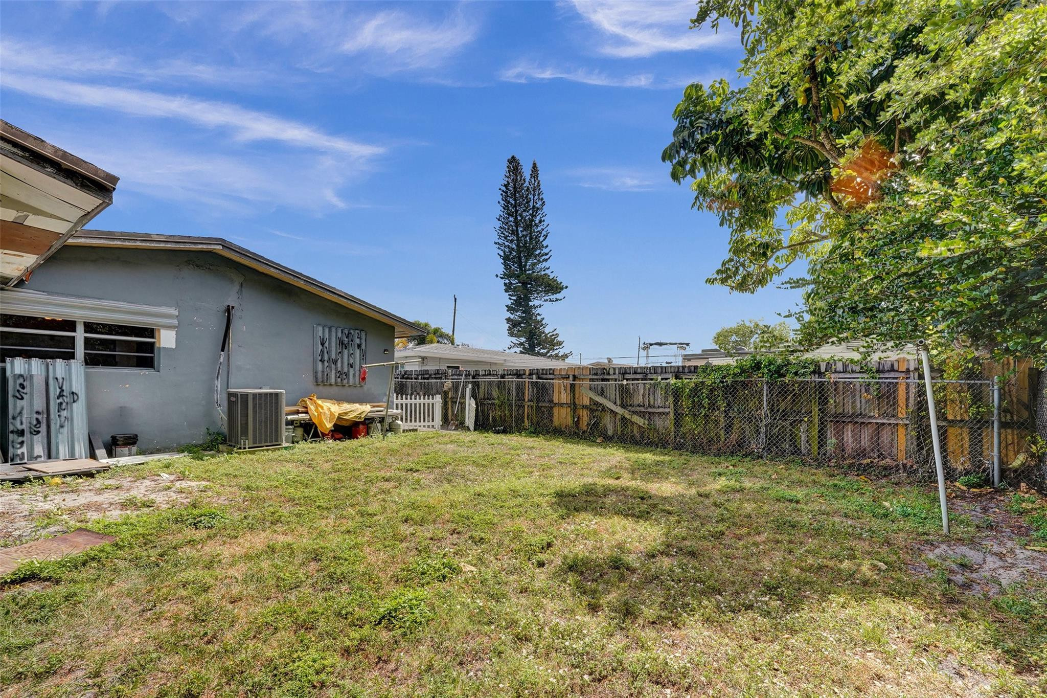 1960 Southwest 68th Way Miramar, FL 33023 - Photo 35 of 39 a view of a house with a yard