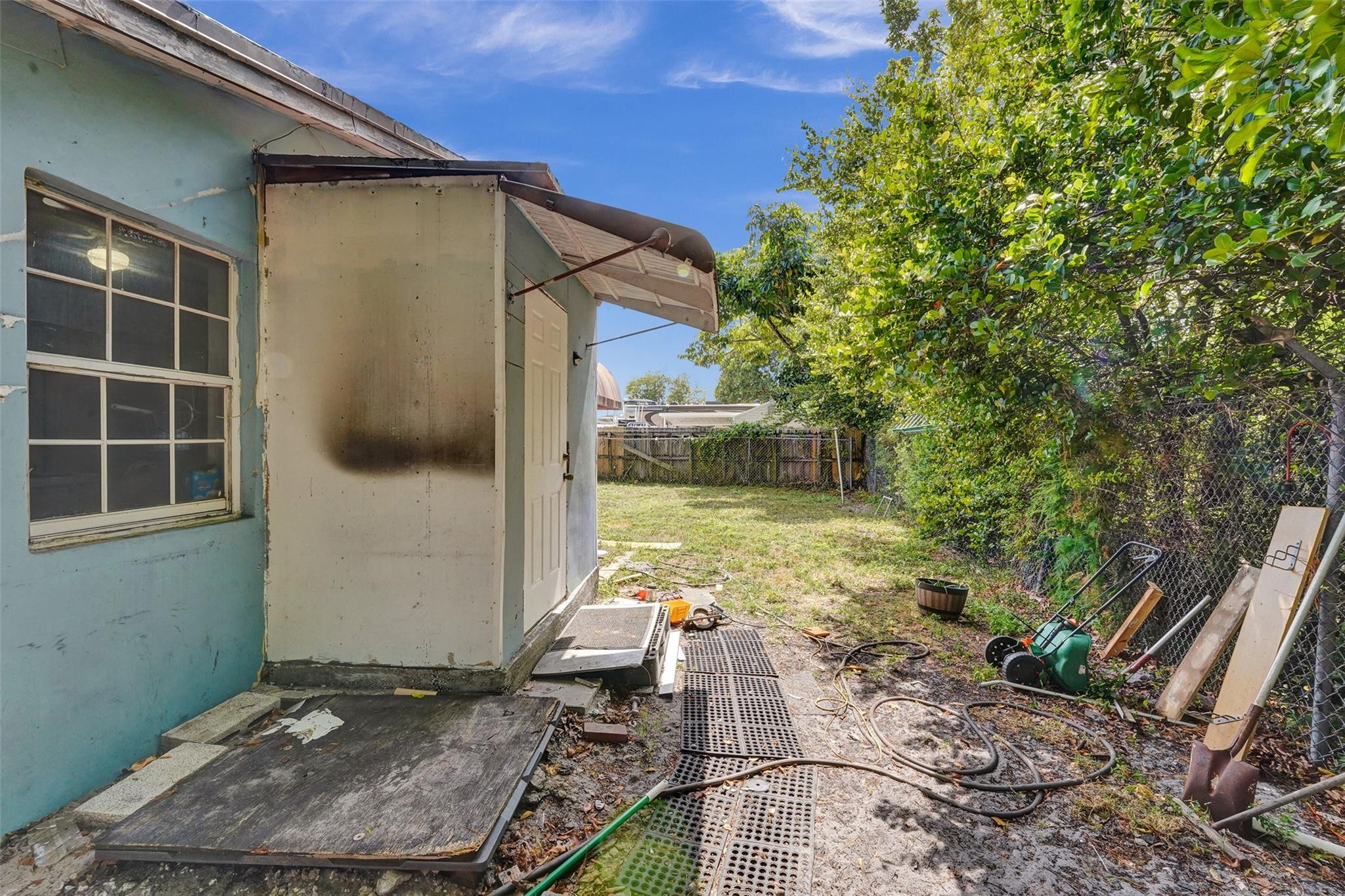 1960 Southwest 68th Way Miramar, FL 33023 - Photo 39 of 39 a backyard of a house with seating space