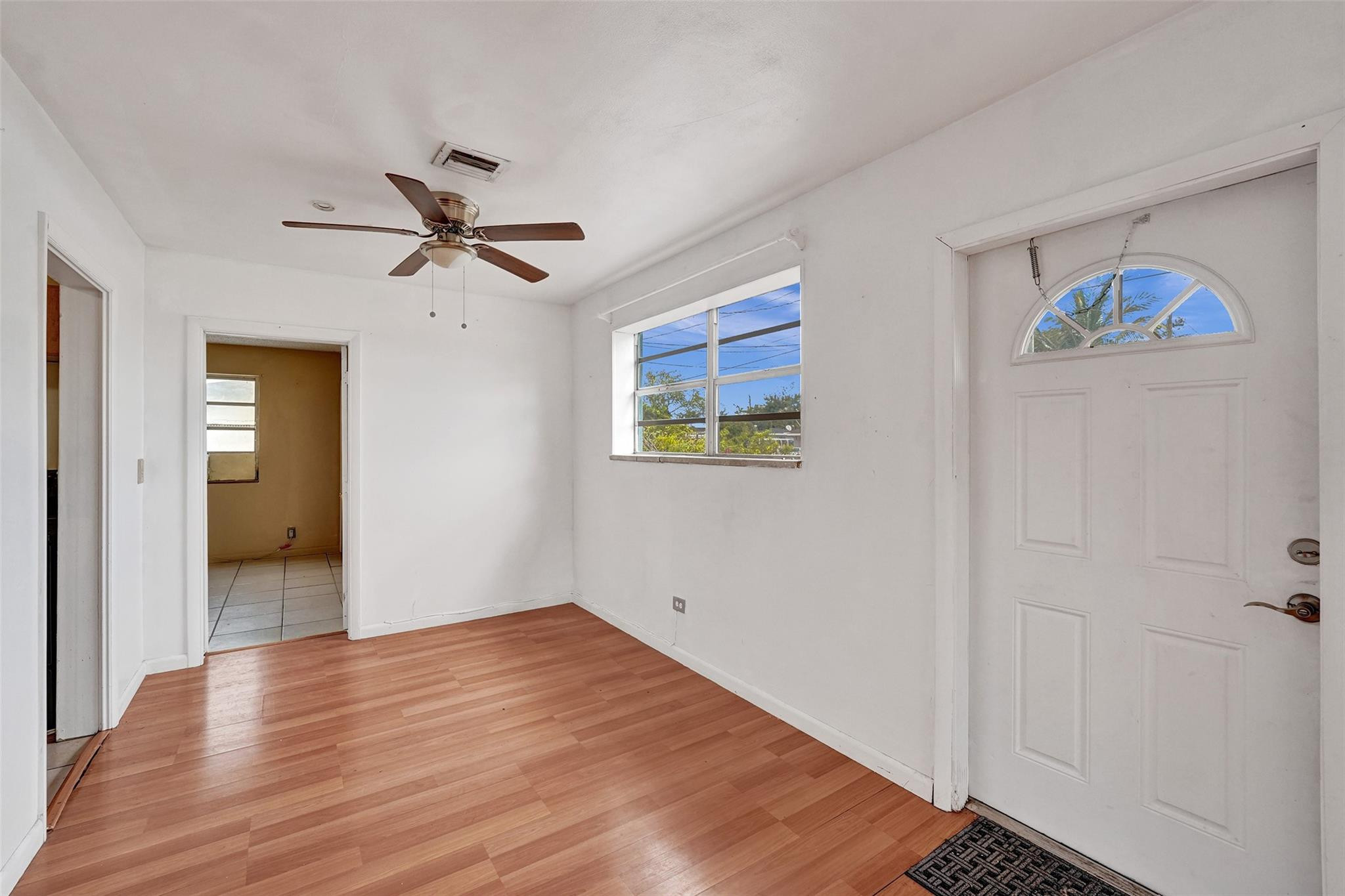 1960 Southwest 68th Way Miramar, FL 33023 - Photo 7 of 39 a view of empty room with wooden floor
