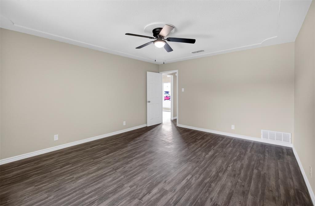 7528 Meadowlark Lane North Watauga, TX 76148 - Photo 21 of 31 a view of an empty room and wooden floor