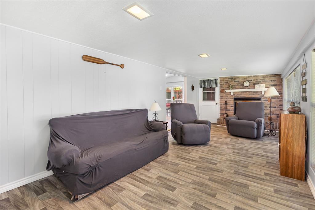 277 Private Road Pittsburg, TX 75686 - Photo 11 of 40 a living room with furniture and a wooden floor