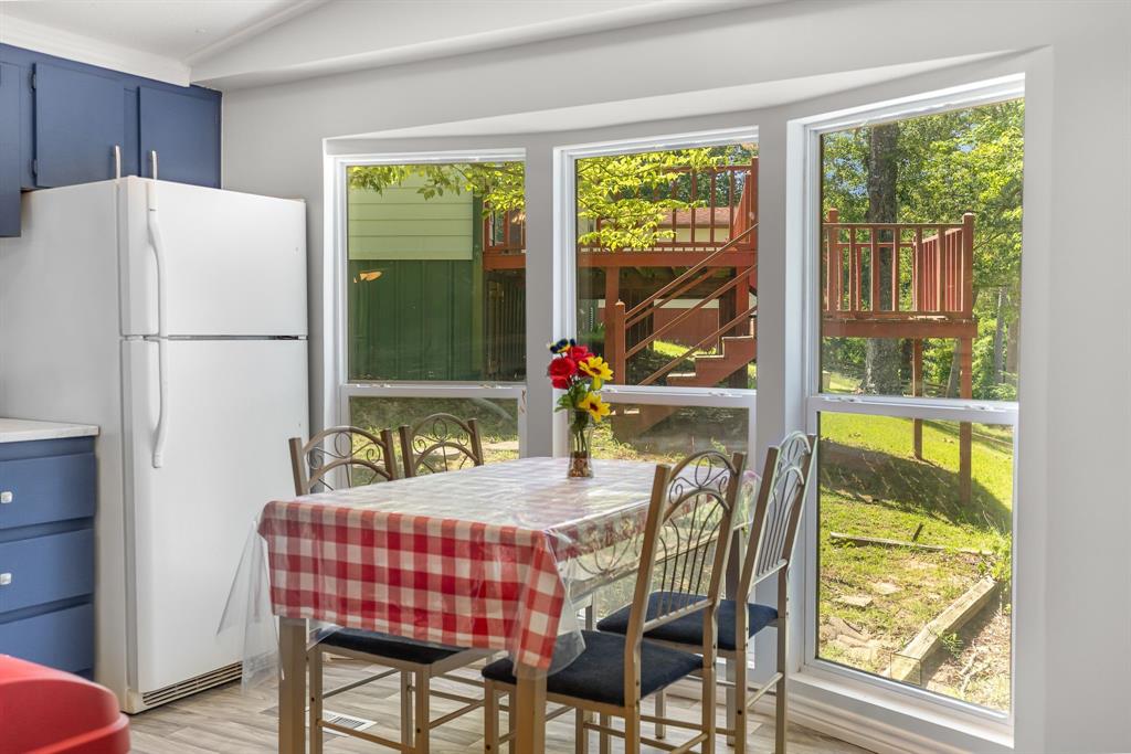 277 Private Road Pittsburg, TX 75686 - Photo 12 of 40 a dining room with furniture and a window