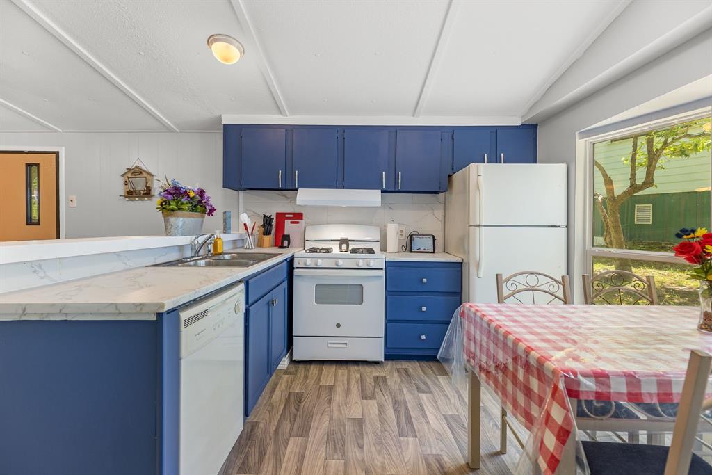 277 Private Road Pittsburg, TX 75686 - Photo 16 of 40 a kitchen with a sink refrigerator and window