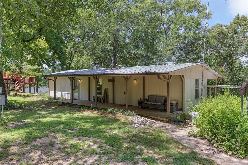 277 Private Road Pittsburg, TX 75686 - Photo 2 of 40 a view of a house with a yard