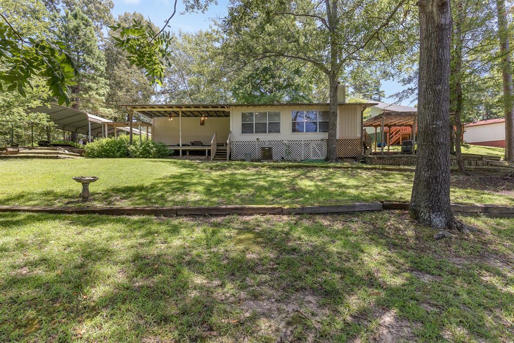 277 Private Road Pittsburg, TX 75686 - Photo 28 of 40 a view of a house with a yard