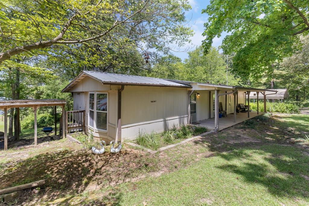 277 Private Road Pittsburg, TX 75686 - Photo 29 of 40 front view of a house with a small yard