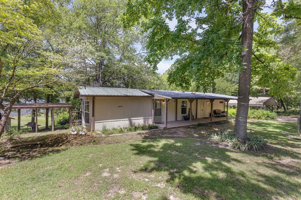 277 Private Road Pittsburg, TX 75686 - Photo 30 of 40 a backyard of a house with yard and barbeque oven