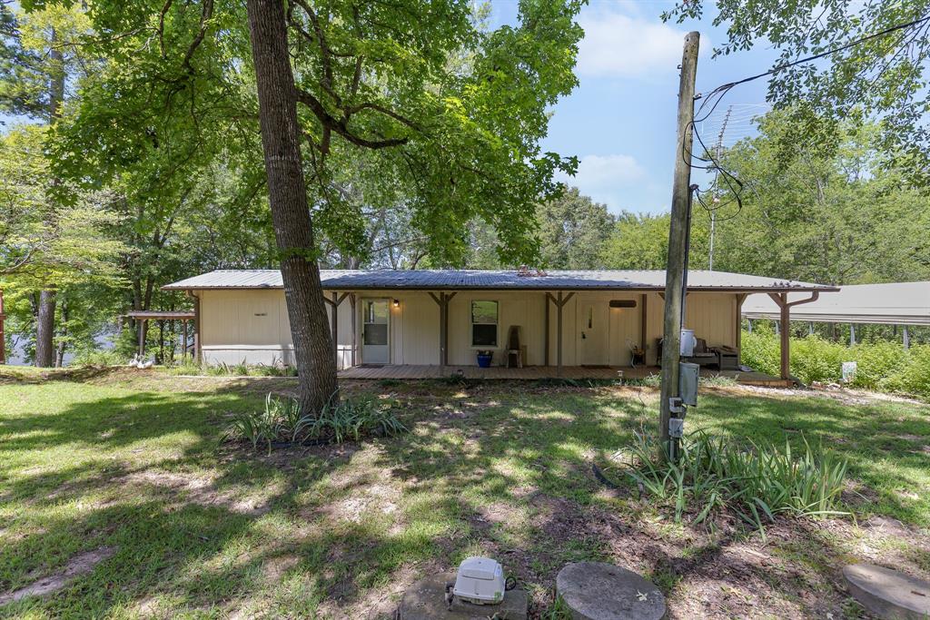 277 Private Road Pittsburg, TX 75686 - Photo 32 of 40 a view of a house with a yard