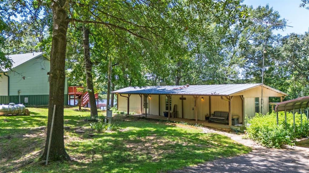 277 Private Road Pittsburg, TX 75686 - Photo 40 of 40 a view of a house with a yard and plants