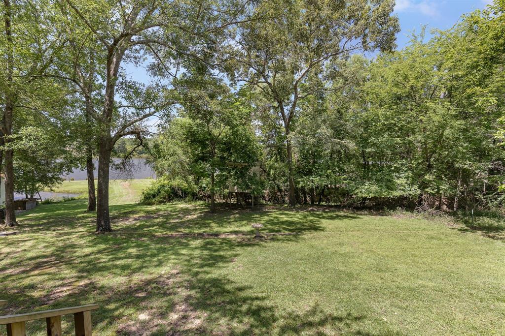 277 Private Road Pittsburg, TX 75686 - Photo 6 of 40 a view of a yard with a tree