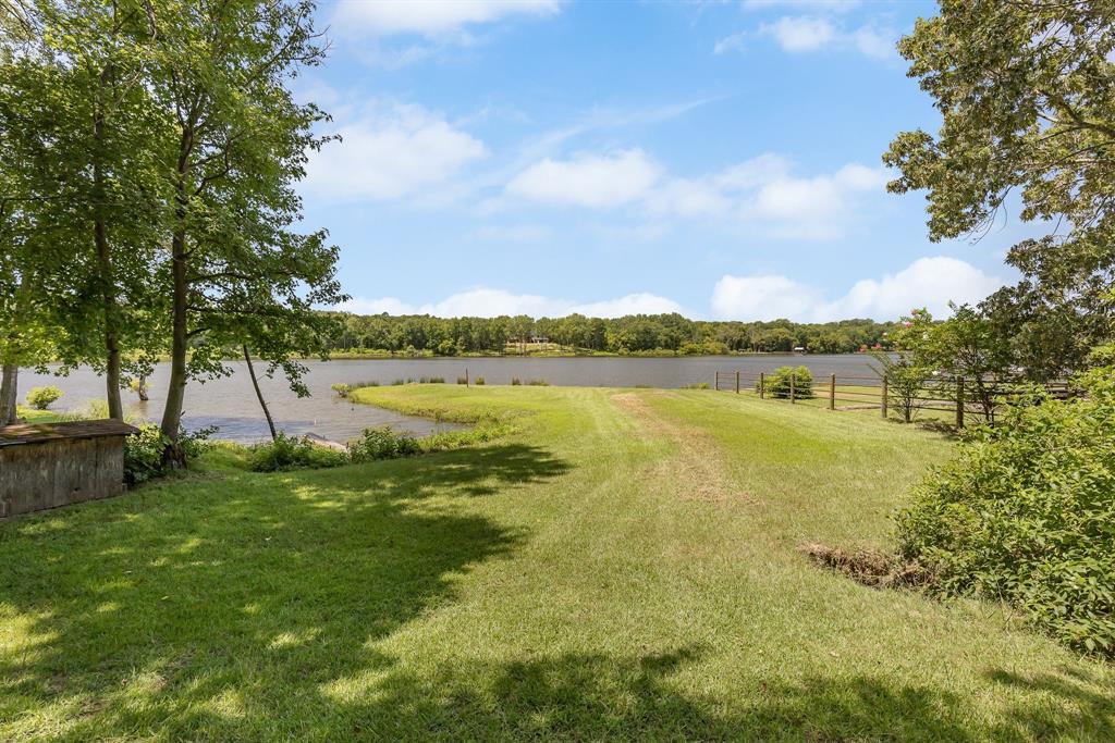 277 Private Road Pittsburg, TX 75686 - Photo 7 of 40 a view of a lake with houses in the background