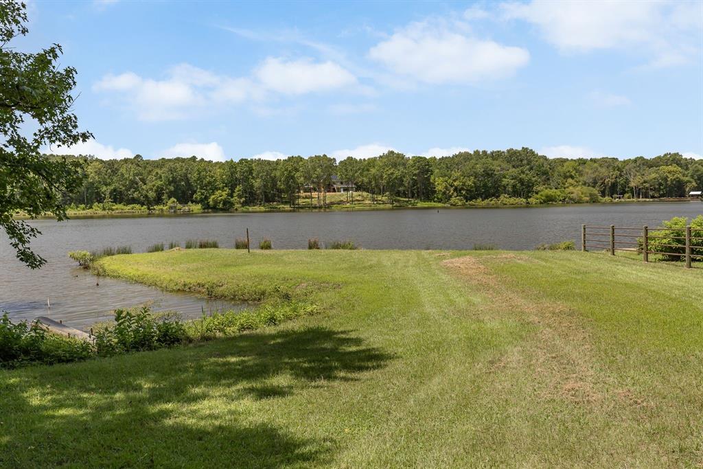 277 Private Road Pittsburg, TX 75686 - Photo 8 of 40 a view of a lake with houses in the back