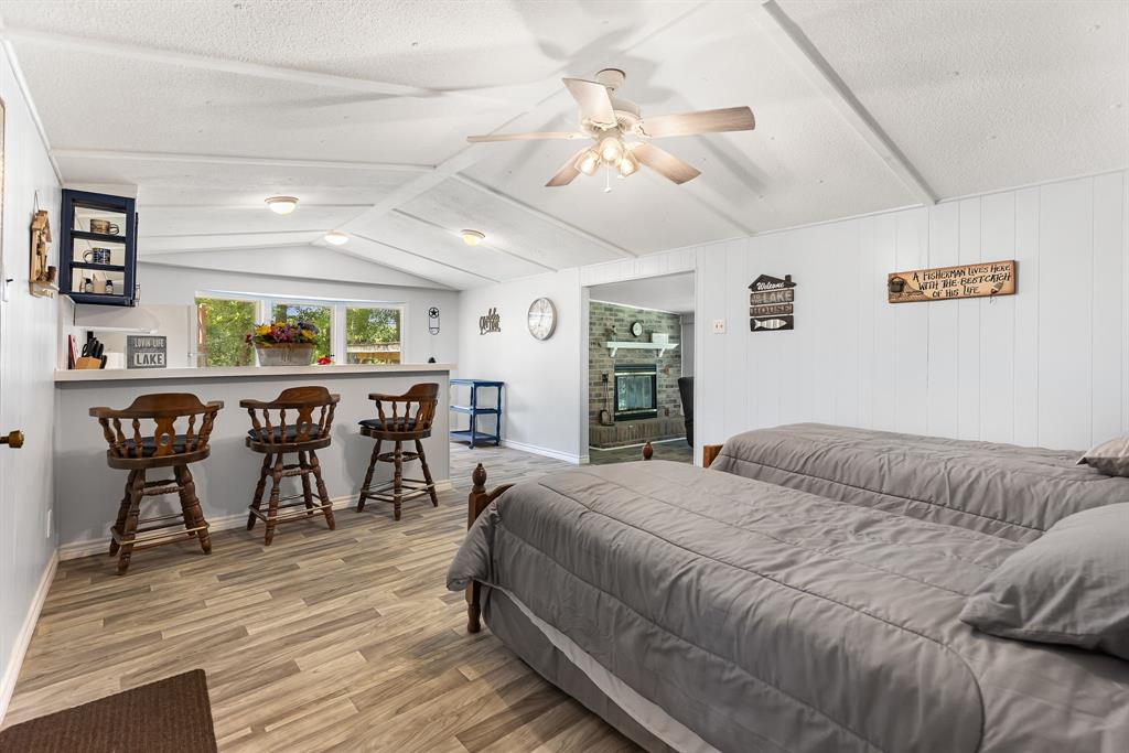 277 Private Road Pittsburg, TX 75686 - Photo 9 of 40 a bedroom with a bed and a table