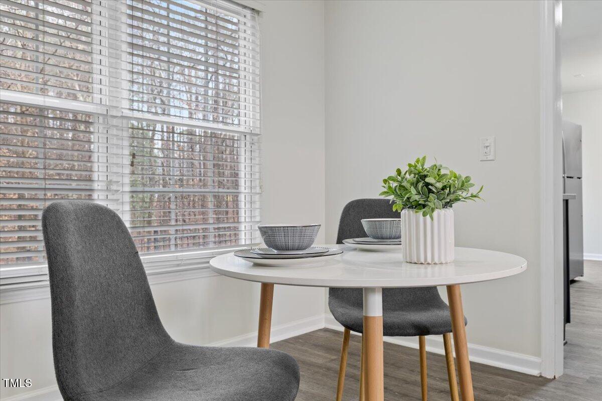 315 Inkster Cove Raleigh, NC 27603 - Photo 11 of 44 a dining room with furniture and wooden floor