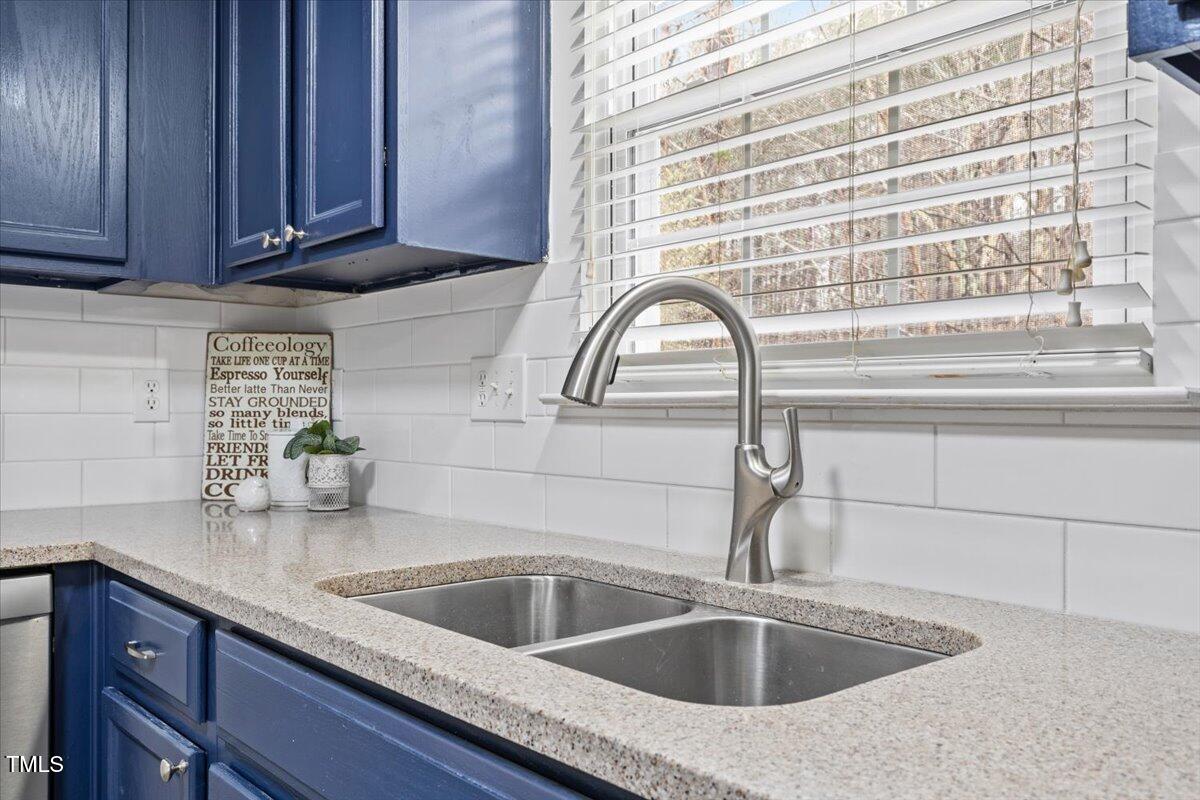 315 Inkster Cove Raleigh, NC 27603 - Photo 17 of 44 a kitchen with a sink and cabinets