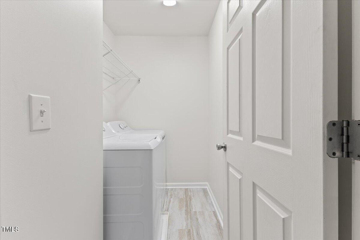 315 Inkster Cove Raleigh, NC 27603 - Photo 28 of 44 a bathroom with a sink and mirror