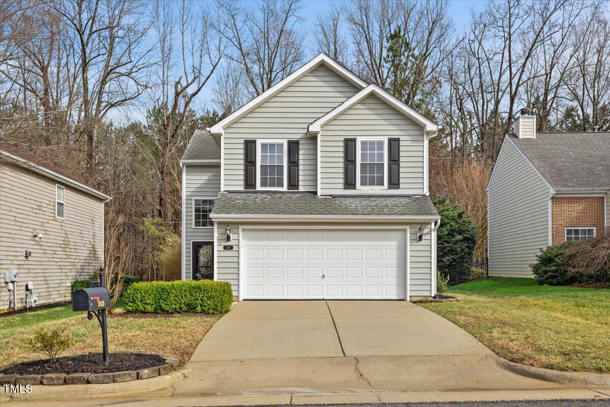 315 Inkster Cove Raleigh, NC 27603 - Photo 3 of 44 a front view of a house with garden