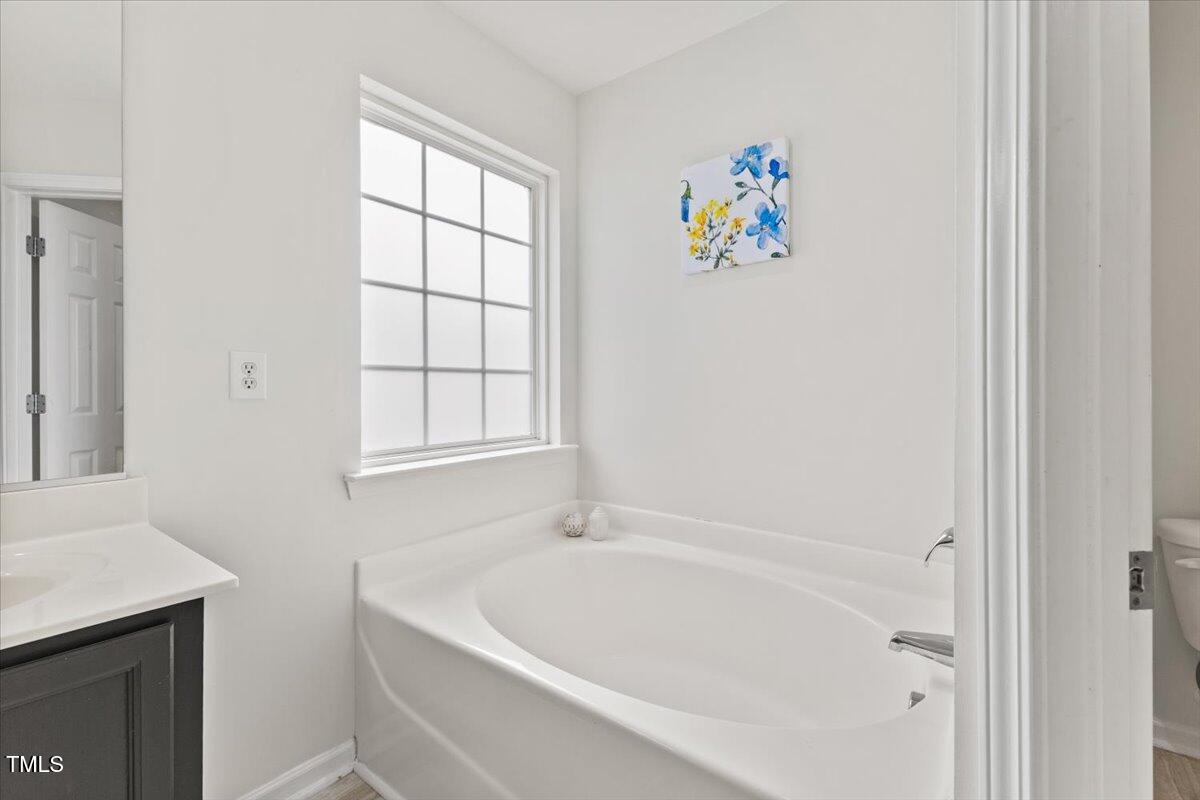 315 Inkster Cove Raleigh, NC 27603 - Photo 34 of 44 a white bath tub with a window