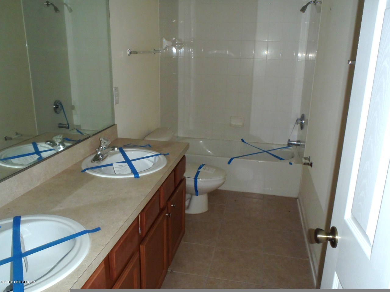 6700 Bowden Road, Unit 302 Jacksonville, FL 32216 - Photo 2 of 11 a bathroom with a sink a toilet and shower